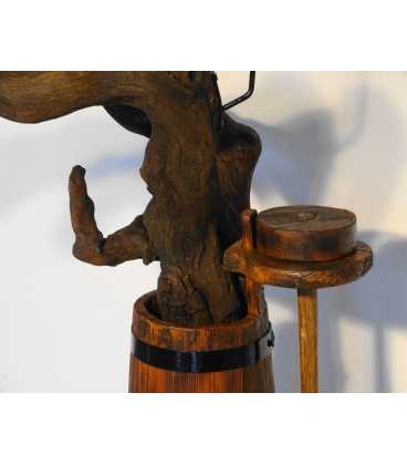 Candle holder formed of a tree root and an old butter churn